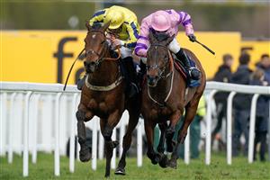 ESHER, ENGLAND - MARCH 11: Connor Brace riding Crambo (pink) clear the last to win The European Breeders' Fund Betfair 'National Hunt' Novices' Handicap Hurdle Final from Jamie Moore and Inneston (L) at Sandown Park on March 11, 2023 in Esher, England. (Photo by Alan Crowhurst/Getty Images)