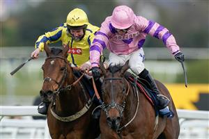 ESHER, ENGLAND - MARCH 11: Connor Brace riding Crambo (pink) clear the last to win The European Breeders' Fund Betfair 'National Hunt' Novices' Handicap Hurdle Final from Jamie Moore and Inneston (L) at Sandown Park on March 11, 2023 in Esher, England. (Photo by Alan Crowhurst/Getty Images)