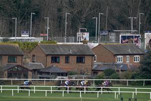 ESHER, ENGLAND - MARCH 11: Runners pass Esher station during The British Stallion Studs EBF Mares' Standard Open NH Flat Race at Sandown Park on March 11, 2023 in Esher, England. (Photo by Alan Crowhurst/Getty Images)