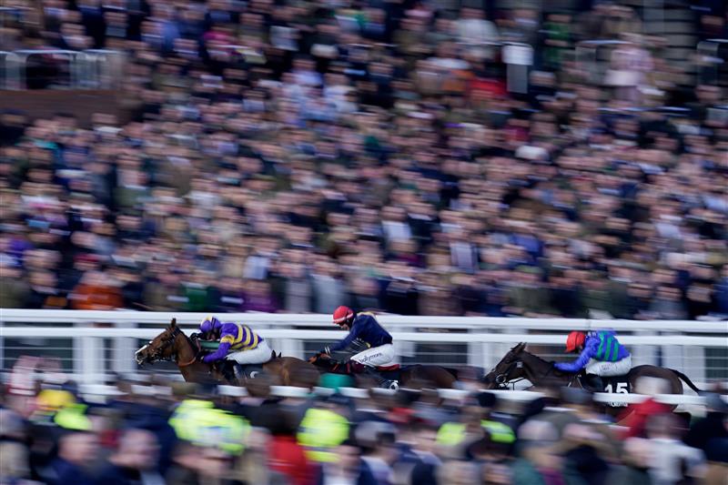CHELTENHAM, ENGLAND - MARCH 14: Derek Fox riding Coach Rambler (L) win The Ultima Handicap Chase during day one of the Cheltenham Festival 2023 at Cheltenham Racecourse on March 14, 2023 in Cheltenham, England. (Photo by Alan Crowhurst/Getty Images)