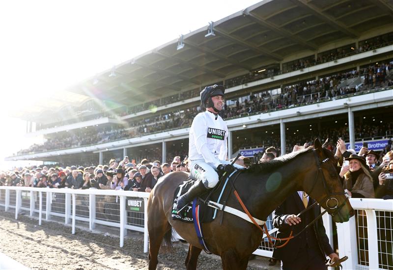 CHELTENHAM, ENGLAND - MARCH 14: Nico de Boinville celebrates on board Constitution Hill after winning the the Unibet Champion Hurdle Challenge Trophy during day one of the Cheltenham Festival 2023 at Cheltenham Racecourse on March 14, 2023 in Cheltenham, England. (Photo by Michael Steele/Getty Images)