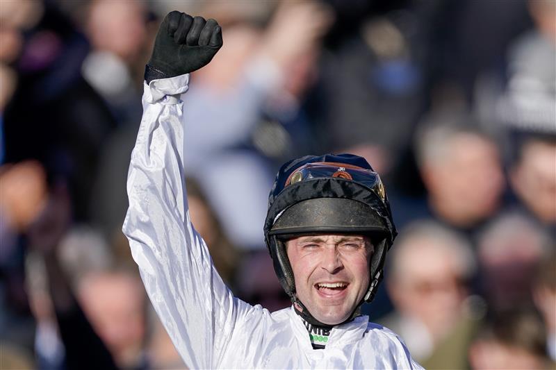 CHELTENHAM, ENGLAND - MARCH 14: Nico de Boinville celebrates after riding Constitution Hill to win The Unibet Champion Hurdle Challenge Trophy during day one of the Cheltenham Festival 2023 at Cheltenham Racecourse on March 14, 2023 in Cheltenham, England. (Photo by Alan Crowhurst/Getty Images)