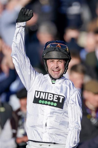 CHELTENHAM, ENGLAND - MARCH 14: Nico de Boinville celebrates after riding Constitution Hill to win The Unibet Champion Hurdle Challenge Trophy during day one of the Cheltenham Festival 2023 at Cheltenham Racecourse on March 14, 2023 in Cheltenham, England. (Photo by Alan Crowhurst/Getty Images)