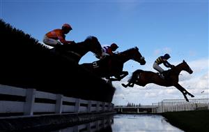 CHELTENHAM, ENGLAND - MARCH 14: Runners take the water jump during the Ultima Handicap Chase during day one of the Cheltenham Festival 2023 at Cheltenham Racecourse on March 14, 2023 in Cheltenham, England. (Photo by Michael Steele/Getty Images)