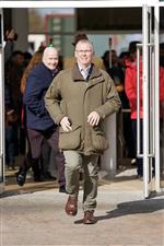 CHELTENHAM, ENGLAND - MARCH 14: The first racegoer through the gates runs to find the best spot during day one of the Cheltenham Festival 2023 at Cheltenham Racecourse on March 14, 2023 in Cheltenham, England. (Photo by Alan Crowhurst/Getty Images)