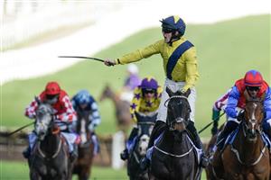 CHELTENHAM, ENGLAND - MARCH 14: Michael O'Sullivan riding Marine Nationale (yellow) clear the last to win The Sky Bet Supreme Novices' Hurdle during day one of the Cheltenham Festival 2023 at Cheltenham Racecourse on March 14, 2023 in Cheltenham, England. (Photo by Alan Crowhurst/Getty Images)
