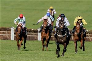 CHELTENHAM, ENGLAND - MARCH 14: Nico de Boinville riding Constitution Hill (white) win The Unibet Champion Hurdle Challenge Trophy during day one of the Cheltenham Festival 2023 at Cheltenham Racecourse on March 14, 2023 in Cheltenham, England. (Photo by Alan Crowhurst/Getty Images)