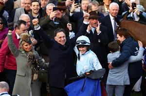 CHELTENHAM, ENGLAND - MARCH 14: Trainer Henry De Bromhead celebrates alongside Jockey Rachael Blackmore and Wife Heather De Bromhead after Honeysuckle won the Close Brothers Mares' Hurdle during day one of the Cheltenham Festival 2023 at Cheltenham Racecourse on March 14, 2023 in Cheltenham, England. (Photo by Michael Steele/Getty Images)