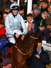 CHELTENHAM, ENGLAND - MARCH 14: Rachael Blackmore celebrates on board Honeysuckle after winning the Close Brothers Mares' Hurdle during day one of the Cheltenham Festival 2023 at Cheltenham Racecourse on March 14, 2023 in Cheltenham, England. (Photo by Michael Steele/Getty Images)