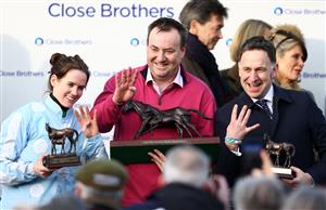 CHELTENHAM, ENGLAND - MARCH 14: Rachael Blackmore poses alognside Trainer Henry De Bromhead (R) and Owner Kenny Alexander(C) after winning the Close Brothers Mares' Hurdle on board Honeysuckle during day one of the Cheltenham Festival 2023 at Cheltenham Racecourse on March 14, 2023 in Cheltenham, England. (Photo by Michael Steele/Getty Images)