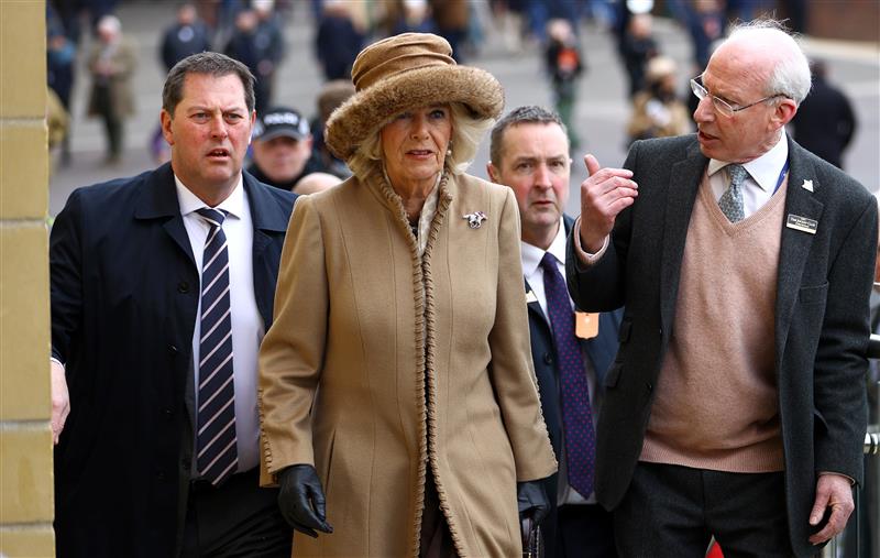 CHELTENHAM, ENGLAND - MARCH 15: Camilla, Queen Consort talks to Ian Renton, Managing Director of Cheltenham Racecourse as she arrives at day two of the Cheltenham Festival 2023 at Cheltenham Racecourse on March 15, 2023 in Cheltenham, England. (Photo by Michael Steele/Getty Images)