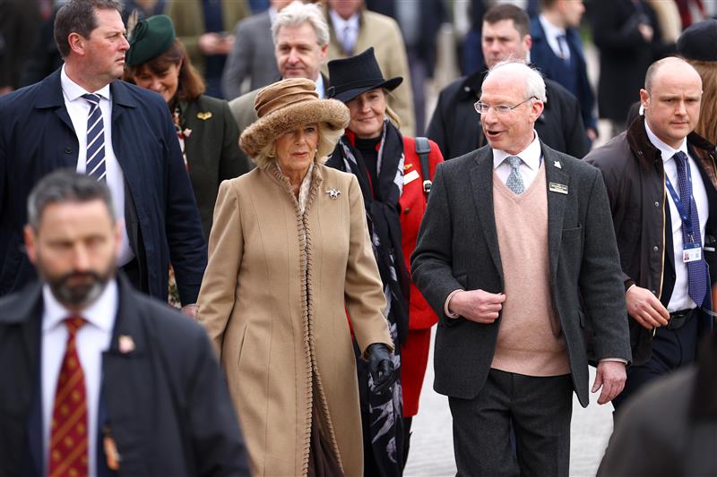 CHELTENHAM, ENGLAND - MARCH 15: Camilla, Queen Consort talks to Ian Renton, Managing Director of Cheltenham Racecourse as she arrives at day two of the Cheltenham Festival 2023 at Cheltenham Racecourse on March 15, 2023 in Cheltenham, England. (Photo by Michael Steele/Getty Images)