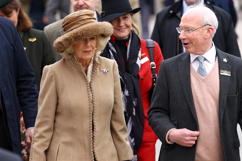 CHELTENHAM, ENGLAND - MARCH 15: Camilla, Queen Consort talks to Ian Renton, Managing Director of Cheltenham Racecourse as she arrives at day two of the Cheltenham Festival 2023 at Cheltenham Racecourse on March 15, 2023 in Cheltenham, England. (Photo by Michael Steele/Getty Images)