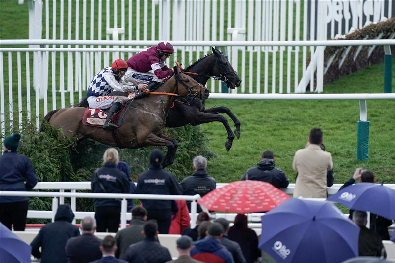 CHELTENHAM, ENGLAND - MARCH 15: Keith Donoghue riding Delta Work (maroon) clear the last to win The Glenfarclas Chase from Davy Russell and Galvin during day two of the Cheltenham Festival 2023 at Cheltenham Racecourse on March 15, 2023 in Cheltenham, England. (Photo by Alan Crowhurst/Getty Images)