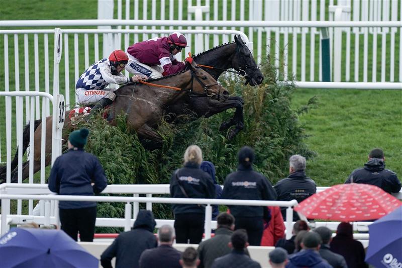 CHELTENHAM, ENGLAND - MARCH 15: Keith Donoghue riding Delta Work (maroon) clear the last to win The Glenfarclas Chase from Davy Russell and Galvin during day two of the Cheltenham Festival 2023 at Cheltenham Racecourse on March 15, 2023 in Cheltenham, England. (Photo by Alan Crowhurst/Getty Images)