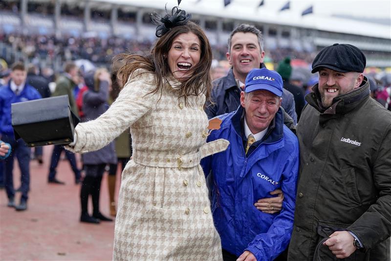 CHELTENHAM, ENGLAND - MARCH 15: Winning connections from the owners and stable staff celebrate the victory of Harry Skelton riding Langer Dan to victory in The Coral Cup Handicap Hurdle during day two of the Cheltenham Festival 2023 at Cheltenham Racecourse on March 15, 2023 in Cheltenham, England. (Photo by Alan Crowhurst/Getty Images)