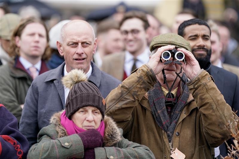 CHELTENHAM, ENGLAND - MARCH 15: Keeping an eye on the action during day two of the Cheltenham Festival 2023 at Cheltenham Racecourse on March 15, 2023 in Cheltenham, England. (Photo by Alan Crowhurst/Getty Images)