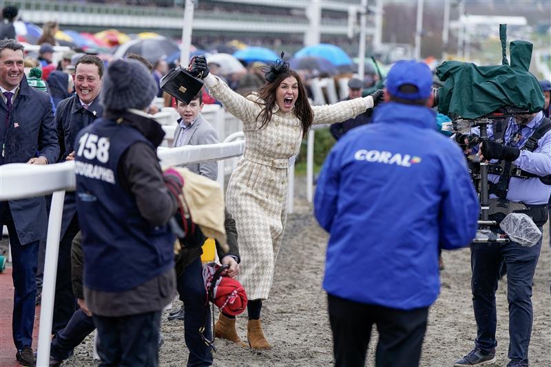 CHELTENHAM, ENGLAND - MARCH 15: Winning connections from the owners and stable staff celebrate the victory of Harry Skelton riding Langer Dan to victory in The Coral Cup Handicap Hurdle during day two of the Cheltenham Festival 2023 at Cheltenham Racecourse on March 15, 2023 in Cheltenham, England. (Photo by Alan Crowhurst/Getty Images)