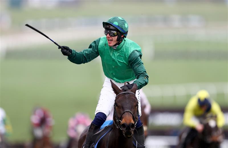 CHELTENHAM, ENGLAND - MARCH 15: Paul Townend riding Impaire Et Passe celebrates winning the Ballymore Novices' Hurdle during day two of the Cheltenham Festival 2023 at Cheltenham Racecourse on March 15, 2023 in Cheltenham, England. (Photo by Michael Steele/Getty Images)