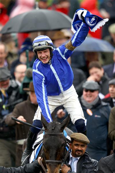CHELTENHAM, ENGLAND - MARCH 15: Paul Townend riding Energumene celebrates victory in the Champion Chase during day two of the Cheltenham Festival 2023 at Cheltenham Racecourse on March 15, 2023 in Cheltenham, England. (Photo by Michael Steele/Getty Images)