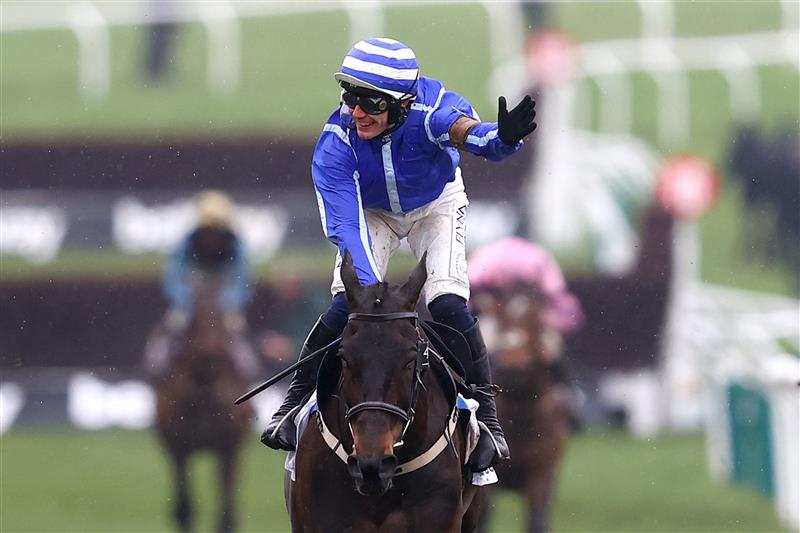 CHELTENHAM, ENGLAND - MARCH 15: Paul Townend riding Energumene celebrates victory in the Champion Chase during day two of the Cheltenham Festival 2023 at Cheltenham Racecourse on March 15, 2023 in Cheltenham, England. (Photo by Michael Steele/Getty Images)