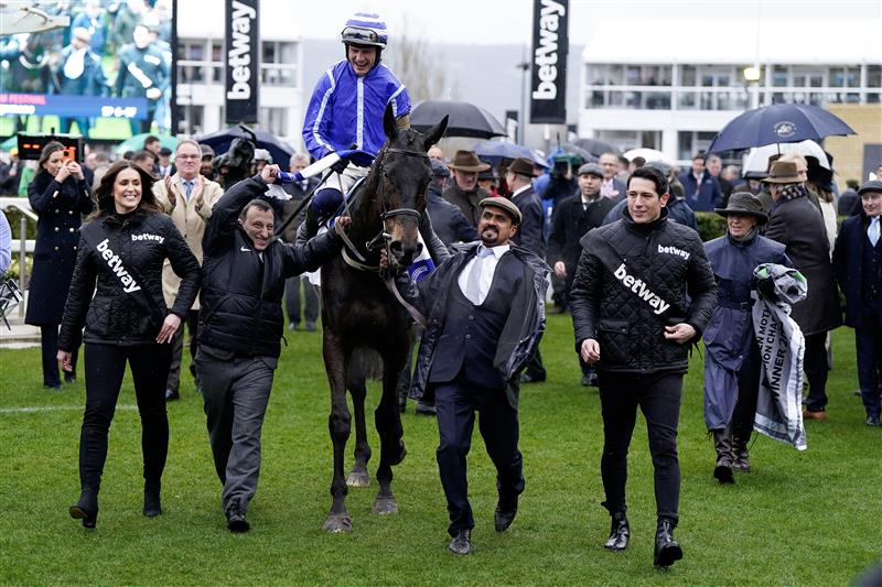 CHELTENHAM, ENGLAND - MARCH 15: Paul Townend riding Energumene return with owner Tony Bloom (L) after winning The Betway Queen Mother Champion Chase during day two of the Cheltenham Festival 2023 at Cheltenham Racecourse on March 15, 2023 in Cheltenham, England. (Photo by Alan Crowhurst/Getty Images)
