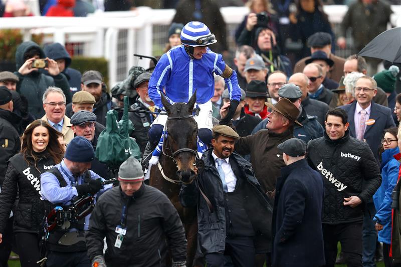 CHELTENHAM, ENGLAND - MARCH 15: Paul Townend riding Energumene celebrates victory in the Champion Chase during day two of the Cheltenham Festival 2023 at Cheltenham Racecourse on March 15, 2023 in Cheltenham, England. (Photo by Michael Steele/Getty Images)