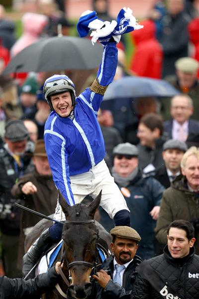 CHELTENHAM, ENGLAND - MARCH 15: Paul Townend riding Energumene celebrates victory in the Champion Chase during day two of the Cheltenham Festival 2023 at Cheltenham Racecourse on March 15, 2023 in Cheltenham, England. (Photo by Michael Steele/Getty Images)