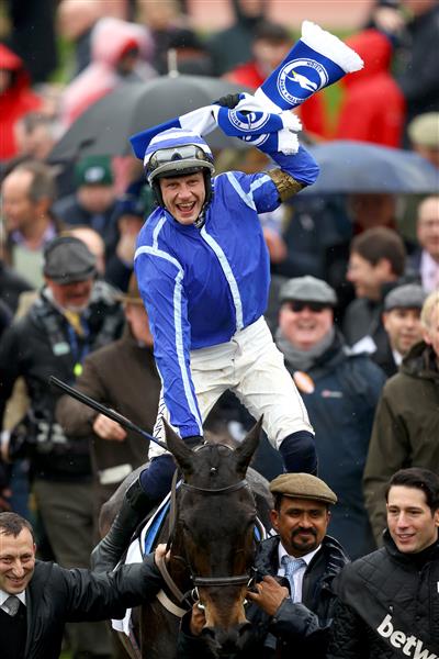 CHELTENHAM, ENGLAND - MARCH 15: Paul Townend riding Energumene celebrates victory in the Champion Chase during day two of the Cheltenham Festival 2023 at Cheltenham Racecourse on March 15, 2023 in Cheltenham, England. (Photo by Michael Steele/Getty Images)