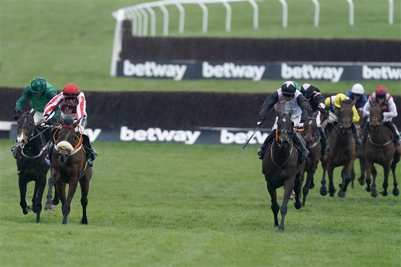 CHELTENHAM, ENGLAND - MARCH 15: Sam Twiston-Davies riding The Real Whacker (red/white) clear the last to win The Brown Advisory Novices' Chase during day two of the Cheltenham Festival 2023 at Cheltenham Racecourse on March 15, 2023 in Cheltenham, England. (Photo by Alan Crowhurst/Getty Images)