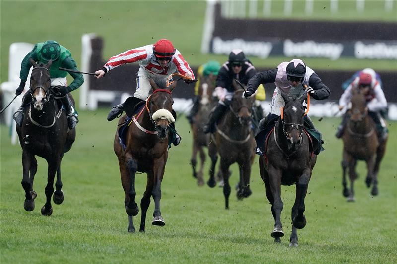 CHELTENHAM, ENGLAND - MARCH 15: Sam Twiston-Davies riding The Real Whacker (red/white) clear the last to win The Brown Advisory Novices' Chase during day two of the Cheltenham Festival 2023 at Cheltenham Racecourse on March 15, 2023 in Cheltenham, England. (Photo by Alan Crowhurst/Getty Images)