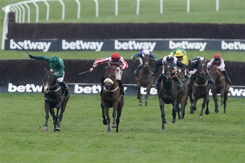 CHELTENHAM, ENGLAND - MARCH 15: Sam Twiston-Davies riding The Real Whacker (red/white) clear the last to win The Brown Advisory Novices' Chase during day two of the Cheltenham Festival 2023 at Cheltenham Racecourse on March 15, 2023 in Cheltenham, England. (Photo by Alan Crowhurst/Getty Images)