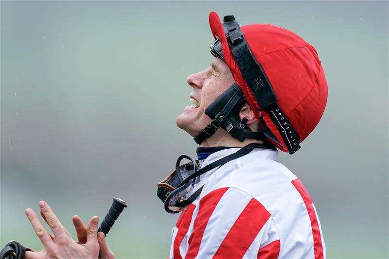 CHELTENHAM, ENGLAND - MARCH 15: Sam Twiston-Davies prays for the photo finish to go his way ceafter riding The Real Whacker to win The Brown Advisory Novices' Chase during day two of the Cheltenham Festival 2023 at Cheltenham Racecourse on March 15, 2023 in Cheltenham, England. (Photo by Alan Crowhurst/Getty Images)