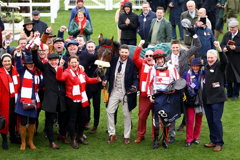 CHELTENHAM, ENGLAND - MARCH 15: Jockey Sam Twiston-Davies celebrates with team after riding The Real Whacker to win the Brown Advisory Novices' Chase during day two of the Cheltenham Festival 2023 at Cheltenham Racecourse on March 15, 2023 in Cheltenham, England. (Photo by Michael Steele/Getty Images)