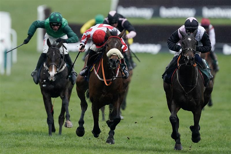 CHELTENHAM, ENGLAND - MARCH 15: Sam Twiston-Davies riding The Real Whacker (red/white) clear the last to win The Brown Advisory Novices' Chase during day two of the Cheltenham Festival 2023 at Cheltenham Racecourse on March 15, 2023 in Cheltenham, England. (Photo by Alan Crowhurst/Getty Images)