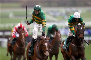 CHELTENHAM, ENGLAND - MARCH 15: John Gleeson riding A Dream to Share celebrates winning the Champion Bumper during day two of the Cheltenham Festival 2023 at Cheltenham Racecourse on March 15, 2023 in Cheltenham, England. (Photo by Michael Steele/Getty Images)