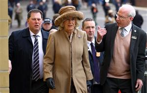CHELTENHAM, ENGLAND - MARCH 15: Camilla, Queen Consort talks to Ian Renton, Managing Director of Cheltenham Racecourse as she arrives at day two of the Cheltenham Festival 2023 at Cheltenham Racecourse on March 15, 2023 in Cheltenham, England. (Photo by Michael Steele/Getty Images)