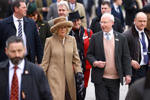 CHELTENHAM, ENGLAND - MARCH 15: Camilla, Queen Consort talks to Ian Renton, Managing Director of Cheltenham Racecourse as she arrives at day two of the Cheltenham Festival 2023 at Cheltenham Racecourse on March 15, 2023 in Cheltenham, England. (Photo by Michael Steele/Getty Images)