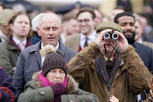 CHELTENHAM, ENGLAND - MARCH 15: Keeping an eye on the action during day two of the Cheltenham Festival 2023 at Cheltenham Racecourse on March 15, 2023 in Cheltenham, England. (Photo by Alan Crowhurst/Getty Images)
