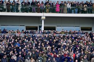 CHELTENHAM, ENGLAND - MARCH 15: Racegoers watch the action during day two of the Cheltenham Festival 2023 at Cheltenham Racecourse on March 15, 2023 in Cheltenham, England. (Photo by Alan Crowhurst/Getty Images)