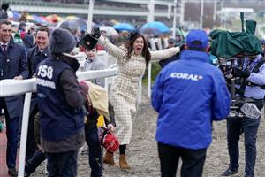 CHELTENHAM, ENGLAND - MARCH 15: Winning connections from the owners and stable staff celebrate the victory of Harry Skelton riding Langer Dan to victory in The Coral Cup Handicap Hurdle during day two of the Cheltenham Festival 2023 at Cheltenham Racecourse on March 15, 2023 in Cheltenham, England. (Photo by Alan Crowhurst/Getty Images)
