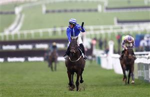 CHELTENHAM, ENGLAND - MARCH 15: Paul Townend riding Energumene celebrates victory in the Champion Chase during day two of the Cheltenham Festival 2023 at Cheltenham Racecourse on March 15, 2023 in Cheltenham, England. (Photo by Michael Steele/Getty Images)