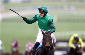 CHELTENHAM, ENGLAND - MARCH 15: Paul Townend riding Impaire Et Passe celebrates winning the Ballymore Novices' Hurdle during day two of the Cheltenham Festival 2023 at Cheltenham Racecourse on March 15, 2023 in Cheltenham, England. (Photo by Michael Steele/Getty Images)