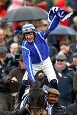 CHELTENHAM, ENGLAND - MARCH 15: Paul Townend riding Energumene celebrates victory in the Champion Chase during day two of the Cheltenham Festival 2023 at Cheltenham Racecourse on March 15, 2023 in Cheltenham, England. (Photo by Michael Steele/Getty Images)