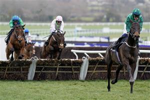 CHELTENHAM, ENGLAND - MARCH 15: Paul Townend riding Impaire Et Passe clear the last to win The Ballymore Novices' Hurdle during day two of the Cheltenham Festival 2023 at Cheltenham Racecourse on March 15, 2023 in Cheltenham, England. (Photo by Alan Crowhurst/Getty Images)