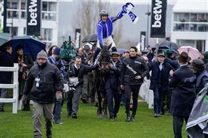 CHELTENHAM, ENGLAND - MARCH 15: Paul Townend riding Energumene return with owner Tony Bloom (L) after winning The Betway Queen Mother Champion Chase during day two of the Cheltenham Festival 2023 at Cheltenham Racecourse on March 15, 2023 in Cheltenham, England. (Photo by Alan Crowhurst/Getty Images)