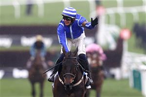 CHELTENHAM, ENGLAND - MARCH 15: Paul Townend riding Energumene celebrates victory in the Champion Chase during day two of the Cheltenham Festival 2023 at Cheltenham Racecourse on March 15, 2023 in Cheltenham, England. (Photo by Michael Steele/Getty Images)