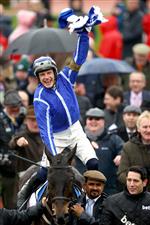 CHELTENHAM, ENGLAND - MARCH 15: Paul Townend riding Energumene celebrates victory in the Champion Chase during day two of the Cheltenham Festival 2023 at Cheltenham Racecourse on March 15, 2023 in Cheltenham, England. (Photo by Michael Steele/Getty Images)