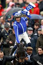 CHELTENHAM, ENGLAND - MARCH 15: Paul Townend riding Energumene celebrates victory in the Champion Chase during day two of the Cheltenham Festival 2023 at Cheltenham Racecourse on March 15, 2023 in Cheltenham, England. (Photo by Michael Steele/Getty Images)