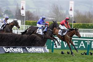 CHELTENHAM, ENGLAND - MARCH 15: Paul Townend riding Energumene (blue) on their way to winning The Betway Queen Mother Champion Chase during day two of the Cheltenham Festival 2023 at Cheltenham Racecourse on March 15, 2023 in Cheltenham, England. (Photo by Alan Crowhurst/Getty Images)